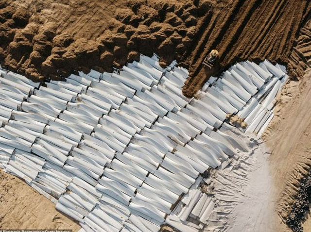 "Incredible photos have revealed the final resting place of massive wind turbine blades that cannot be recycled, and are instead heaped up in piles in landfills. The municipal landfill in Casper, Wyoming, is the repository of at least 870 discarded blades, and one of the few locations in the country that accepts the massive fiberglass objects. Built to withstand hurricane winds, the turbine blades cannot easily be crushed or recycled. About 8,000 of the blades are decommissioned in the U.S. every year." - National Wind Watch